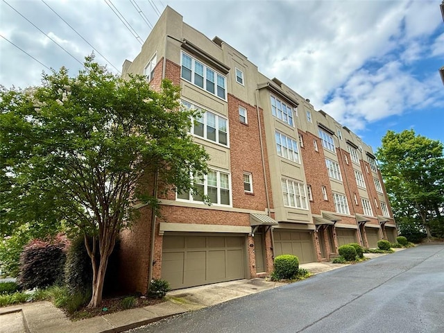 1376 Parkview Ln NE, Atlanta, GA 30324 - view of building exterior with a garage