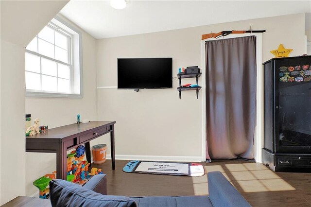 bedroom with wood finished floors, a ceiling fan, and vaulted ceiling