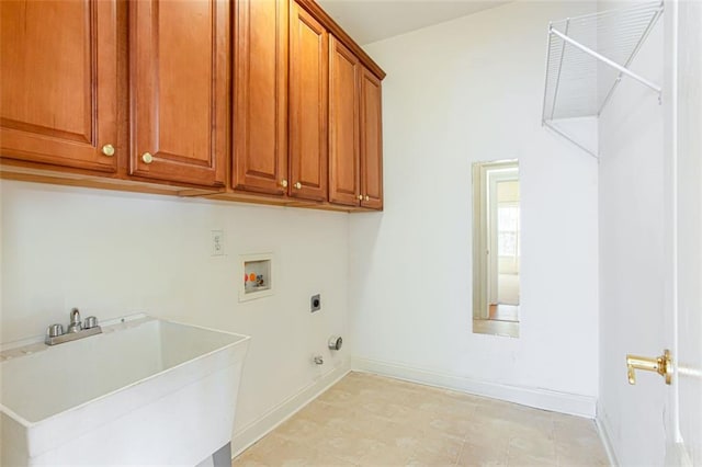 washroom featuring gas dryer hookup, sink, cabinets, washer hookup, and electric dryer hookup