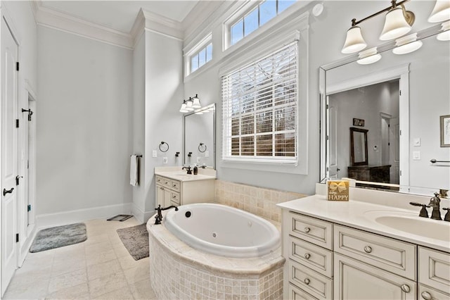 bathroom featuring tiled tub, crown molding, tile patterned flooring, and vanity