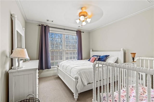 bedroom featuring ornamental molding, light carpet, and ceiling fan