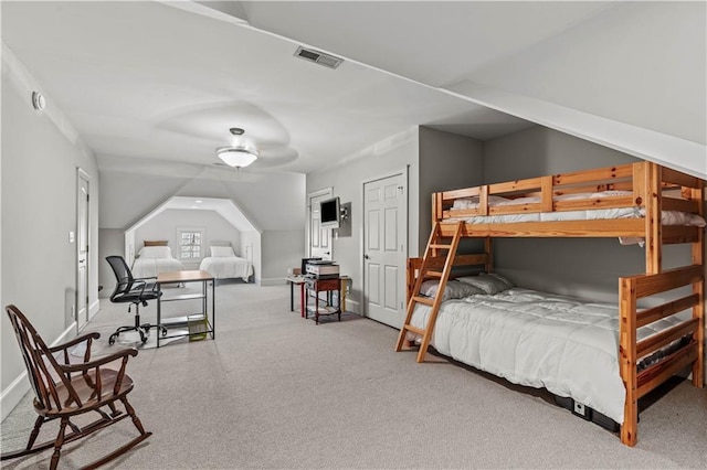 carpeted bedroom featuring vaulted ceiling