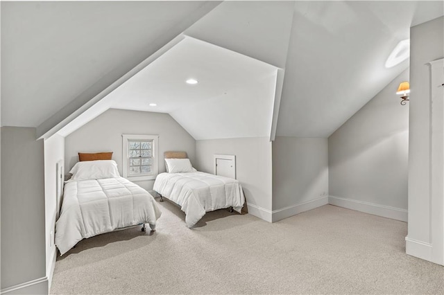 bedroom featuring lofted ceiling and light colored carpet