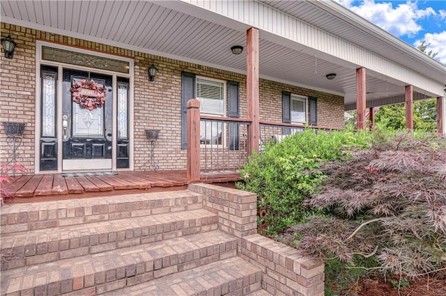 doorway to property featuring covered porch