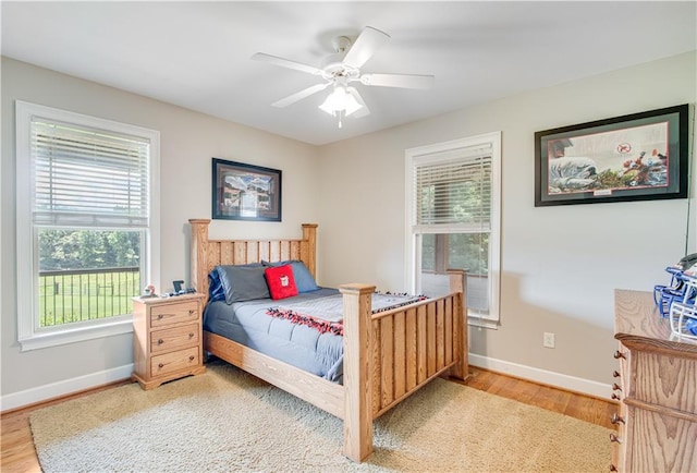 bedroom featuring ceiling fan and light hardwood / wood-style flooring