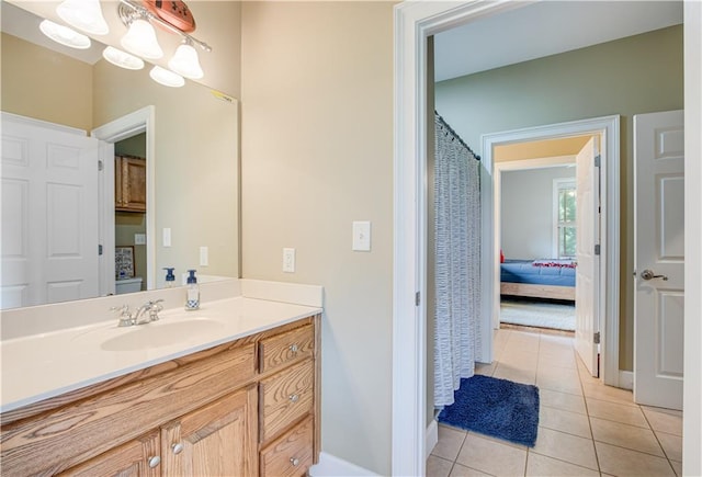 bathroom featuring tile floors and vanity