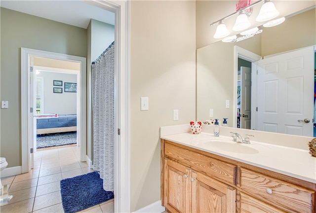 bathroom featuring tile flooring, oversized vanity, and toilet