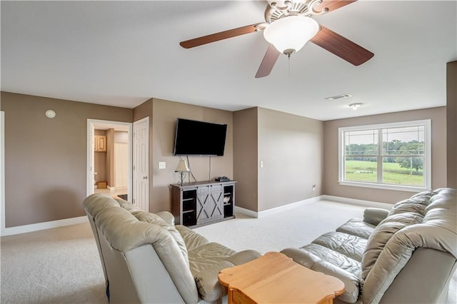 carpeted living room featuring ceiling fan