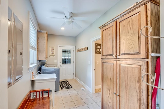 mudroom featuring washer / clothes dryer, ceiling fan, and light tile flooring