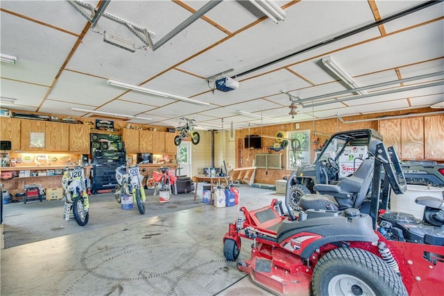 garage featuring a workshop area and a garage door opener