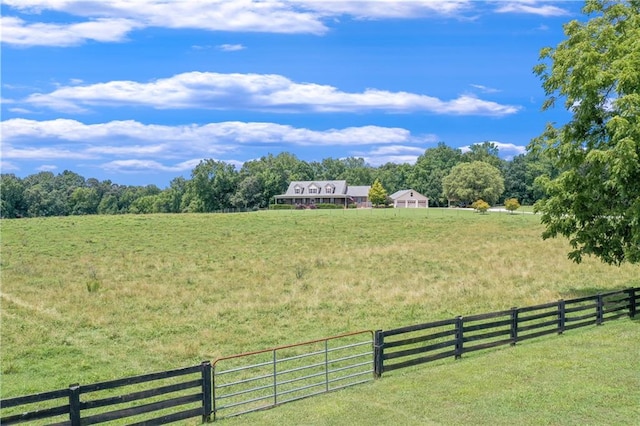 view of yard with a rural view