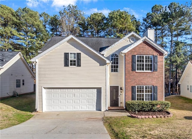 traditional-style home featuring driveway, an attached garage, a chimney, and a front lawn