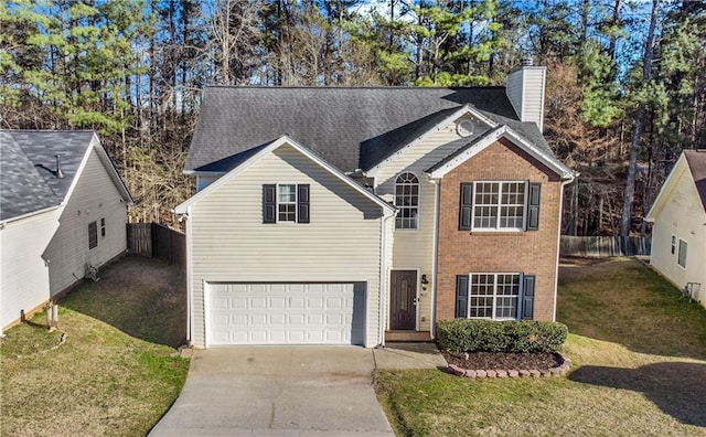 traditional home featuring a chimney, concrete driveway, a front yard, fence, and a garage