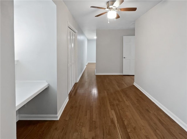 corridor with dark hardwood / wood-style floors