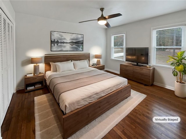 bedroom featuring ceiling fan and dark hardwood / wood-style floors