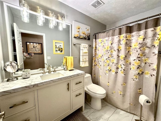 bathroom featuring vanity, a textured ceiling, toilet, and a shower with curtain