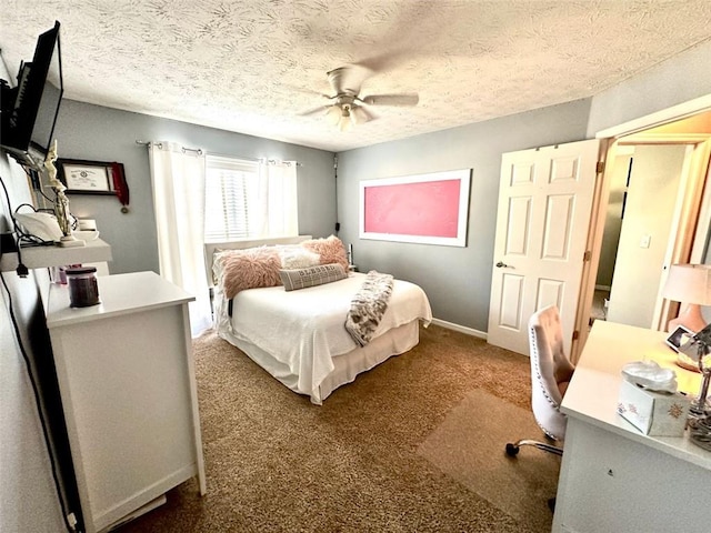 bedroom with ceiling fan, dark colored carpet, and a textured ceiling