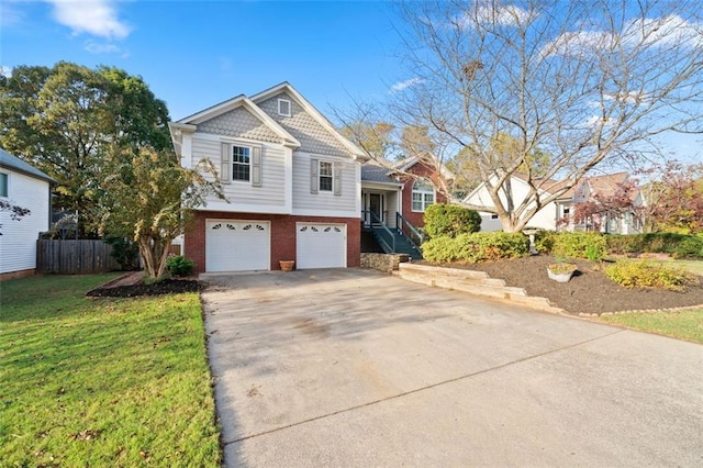 view of front of house with a garage and a front yard