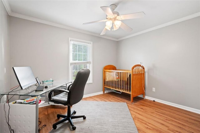 bedroom featuring hardwood / wood-style floors, ceiling fan, a nursery area, and ornamental molding