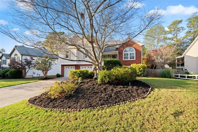 view of front facade featuring a garage and a front yard