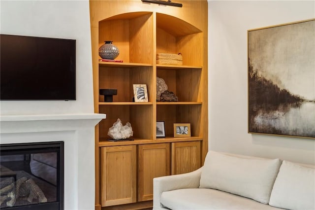 1393 Kings Park Dr NW, Kennesaw, GA 30152 - living area with built in features and a glass covered fireplace