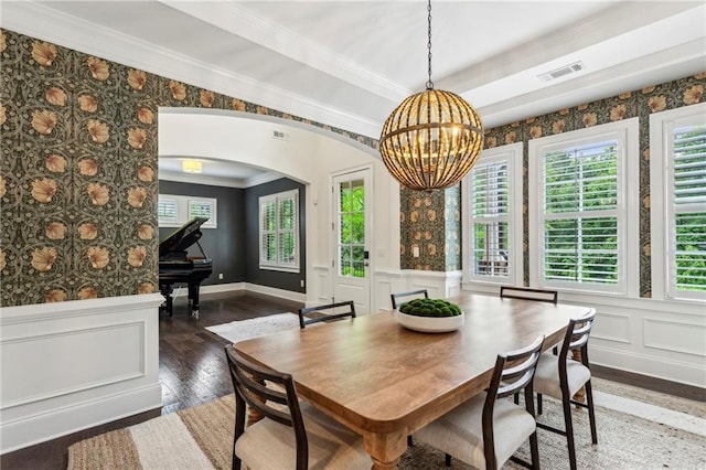 1393 Kings Park Dr NW, Kennesaw, GA 30152 - dining space featuring arched walkways, hardwood / wood-style floors, a chandelier, crown molding, and wainscoting