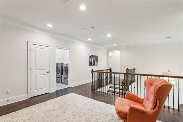 1393 Kings Park Dr NW, Kennesaw, GA 30152 - living area featuring independent washer and dryer, ornamental molding, dark wood finished floors, recessed lighting, and baseboards