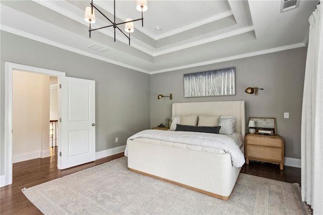 1393 Kings Park Dr NW, Kennesaw, GA 30152 - bedroom with a chandelier, wood finished floors, crown molding, baseboards, and a tray ceiling