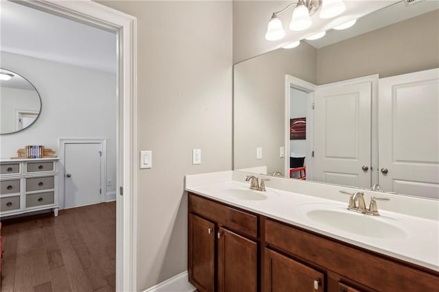 1393 Kings Park Dr NW, Kennesaw, GA 30152 - bathroom featuring double vanity and wood finished floors