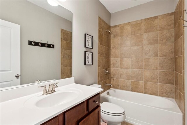 1393 Kings Park Dr NW, Kennesaw, GA 30152 - bathroom featuring toilet, vanity, and shower / tub combination