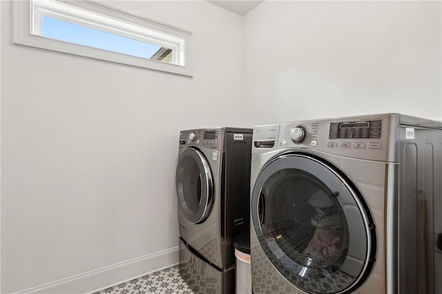 1393 Kings Park Dr NW, Kennesaw, GA 30152 - laundry area with washing machine and clothes dryer, baseboards, and tile patterned floors