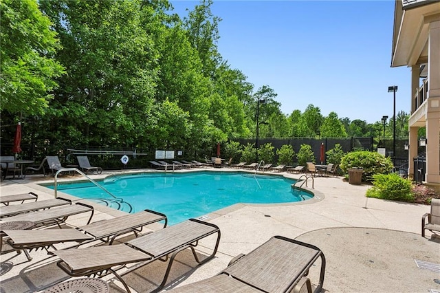 1393 Kings Park Dr NW, Kennesaw, GA 30152 - community pool featuring a patio area and view of scattered trees