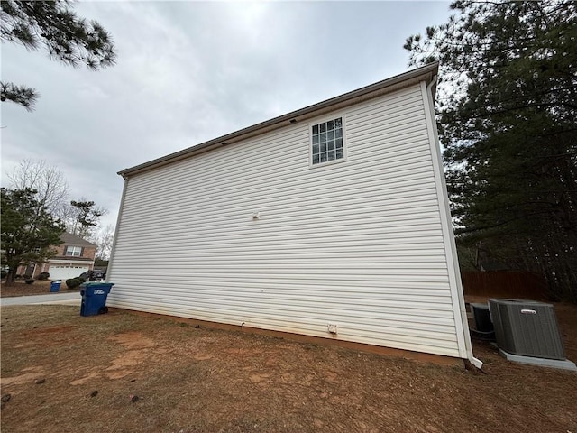 view of side of property with central AC unit