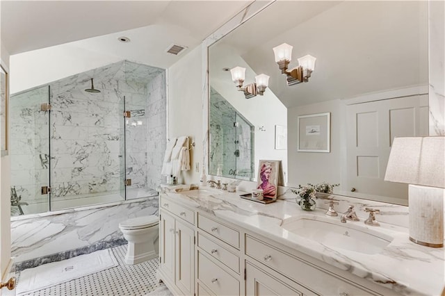 bathroom featuring vaulted ceiling, toilet, double vanity, and a sink