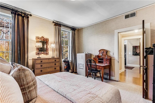 bedroom with visible vents and baseboards