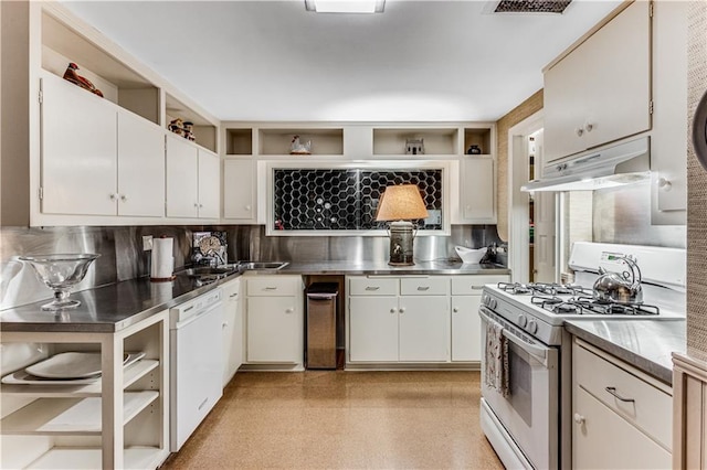 kitchen with under cabinet range hood, white appliances, open shelves, and stainless steel counters