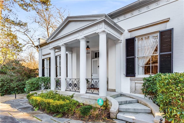 property entrance with covered porch