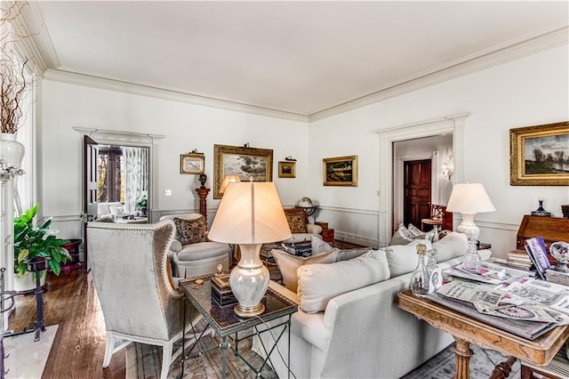 living area with wood finished floors and ornamental molding