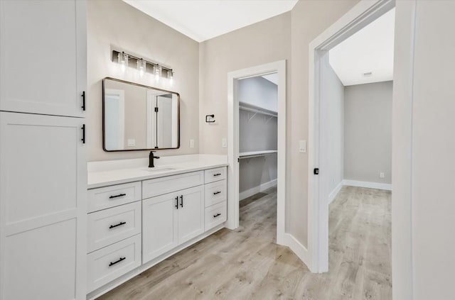 1950 Stethem Fry, Alpharetta, GA 30022 - bathroom with vanity, wood finished floors, and a spacious closet
