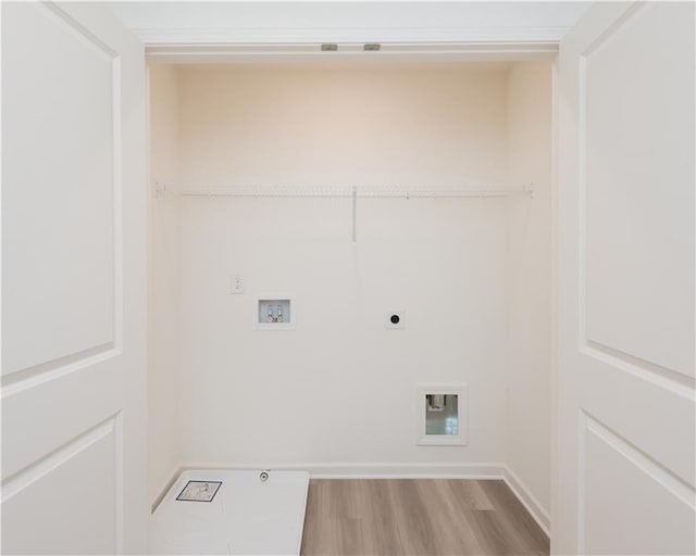 2686 NE Almand Ln NE, Conyers, GA 30013 - washroom with hookup for an electric dryer, washer hookup, and light wood-style flooring