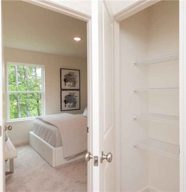 2686 NE Almand Ln NE, Conyers, GA 30013 - bedroom with light colored carpet and recessed lighting