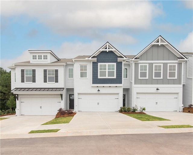 2686 NE Almand Ln NE, Conyers, GA 30013 - townhome / multi-family property with a garage, concrete driveway, and board and batten siding