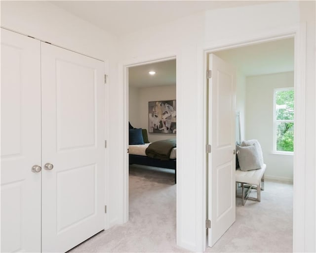 2686 NE Almand Ln NE, Conyers, GA 30013 - hallway featuring light colored carpet and baseboards