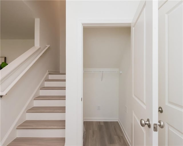 2686 NE Almand Ln NE, Conyers, GA 30013 - stairs featuring wood finished floors and baseboards