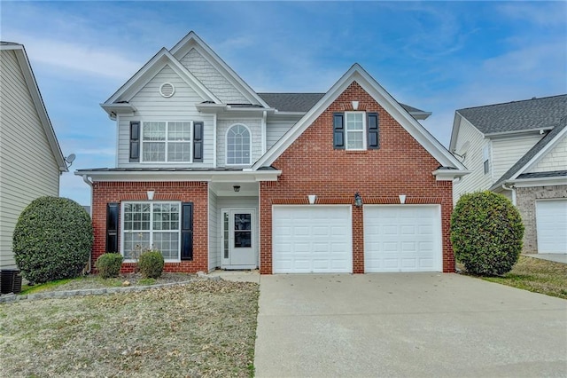 traditional-style house featuring concrete driveway, brick siding, and an attached garage