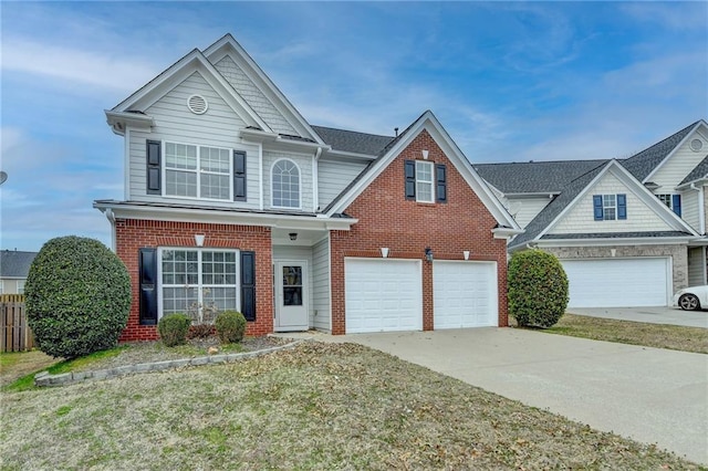 traditional-style house with an attached garage, concrete driveway, and brick siding