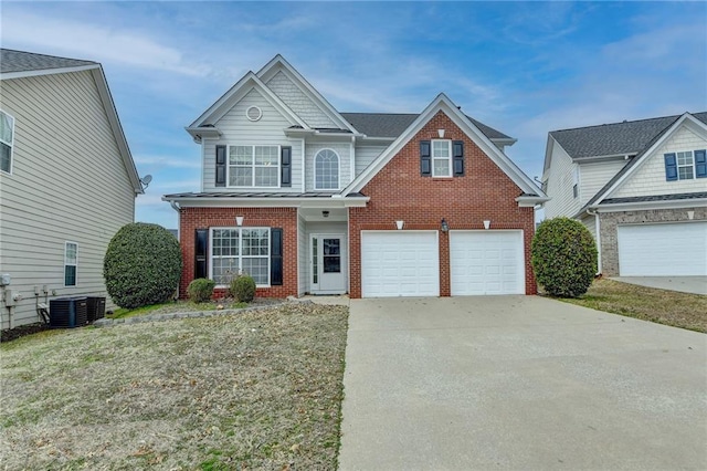 traditional-style home with brick siding, concrete driveway, an attached garage, central AC unit, and a front lawn