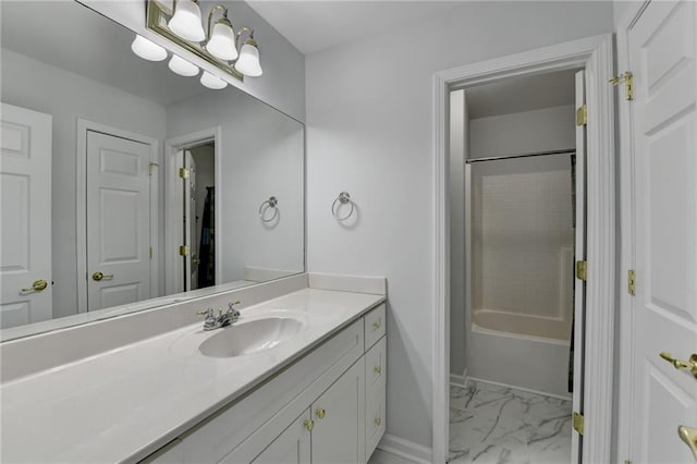 bathroom featuring shower / bath combination, marble finish floor, baseboards, and vanity