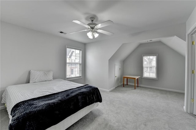 bedroom with baseboards, multiple windows, visible vents, and light colored carpet