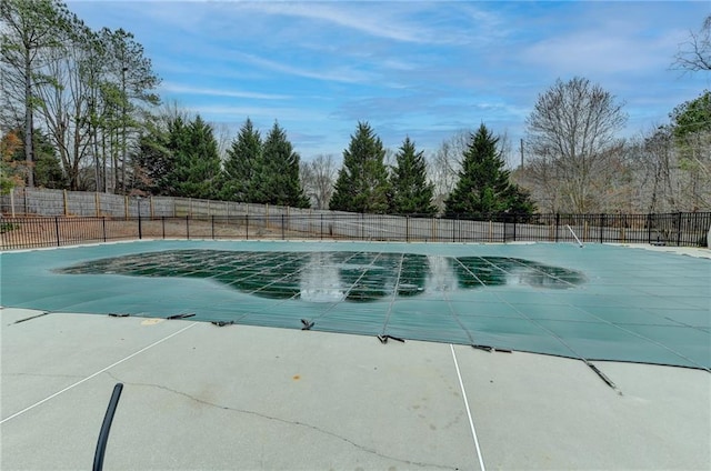 view of pool featuring a patio area, fence, and a fenced in pool